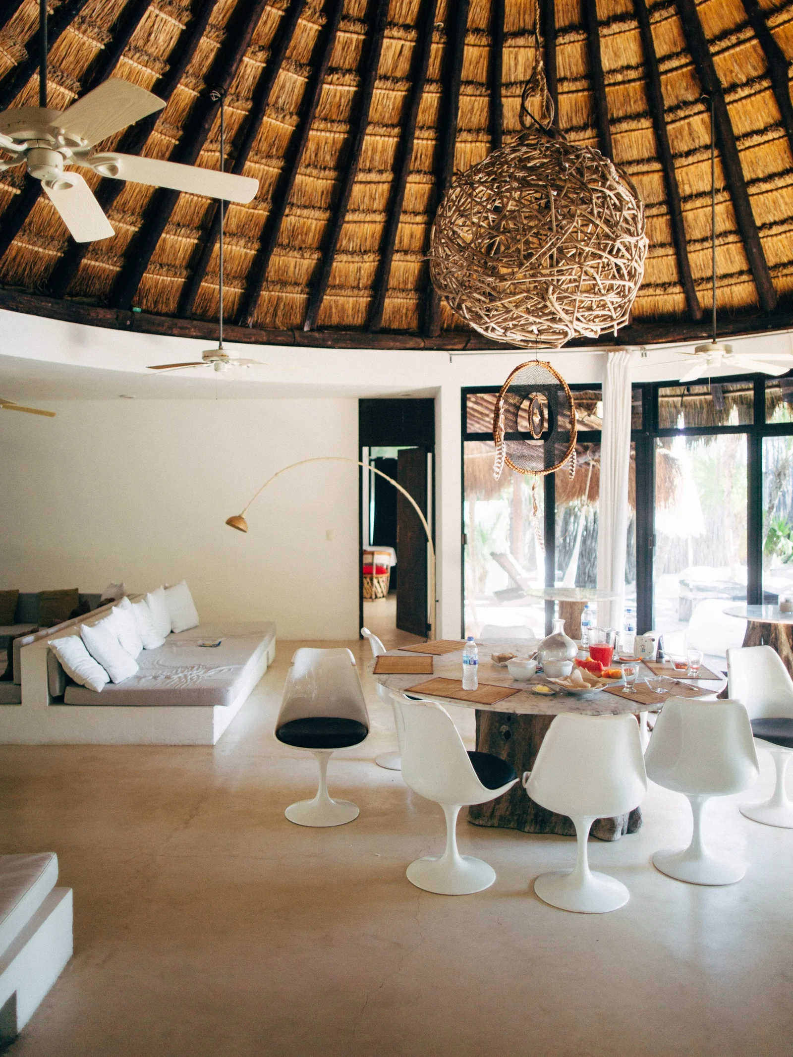 A quiet interior beneath a thatched roof